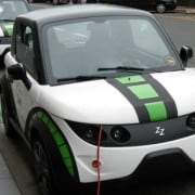 An electric car parked at a charging station