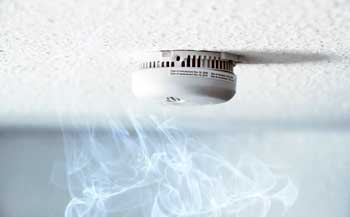Smoke detector picking up smoke that's installed on the ceiling.