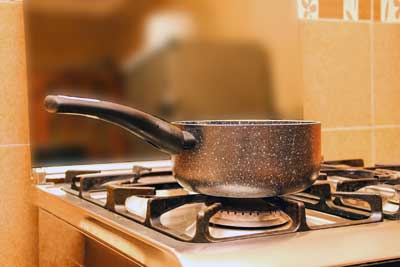 cooking pot sitting on top of stove