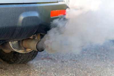 idling car showing exhaust fumes