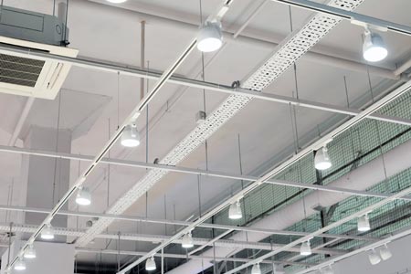 Rows of LED lights in office building 