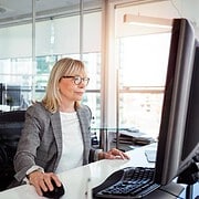 Female office worker using computer