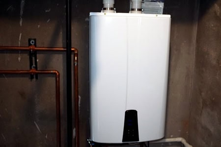 tankless water heater in a utility room.